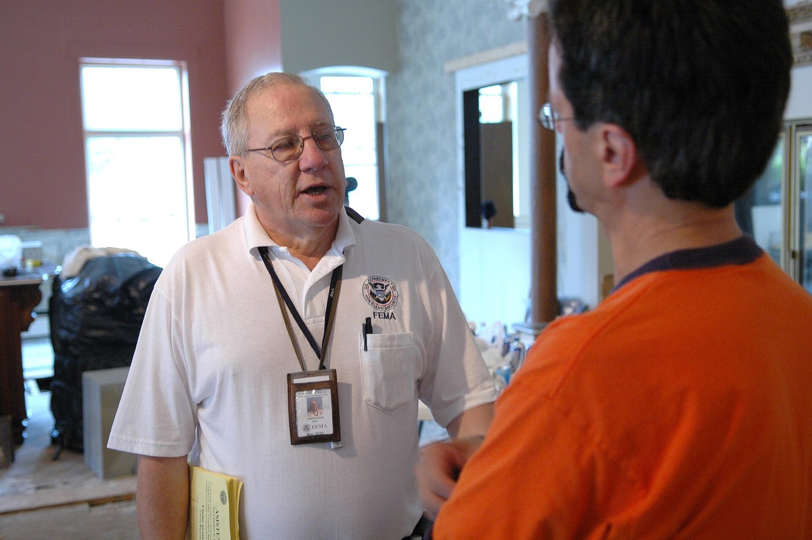 Ottawa, Ohio, August 30, 2007 -- Community Relations (CR) representative James Haas (left) speaks with a local business owner about how S…